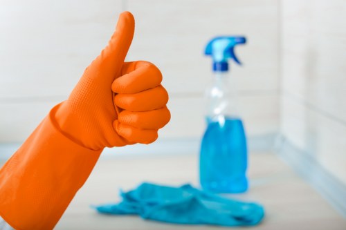 Technician inspecting carpet cleaning products and safety measures