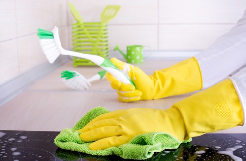 Local curtain care team handling delicate fabrics in South Kensington