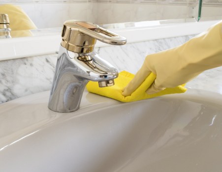 Cleaner checking workspace hazards during a carpet cleaning job